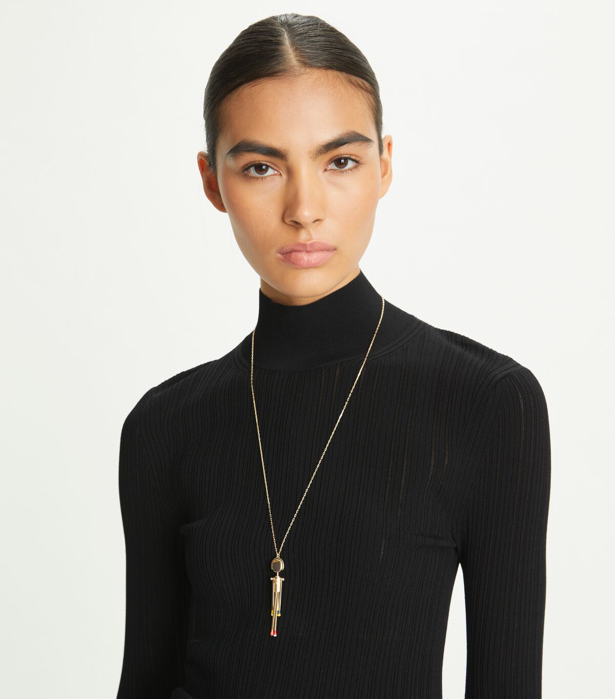 tory burch matchstick person pendant